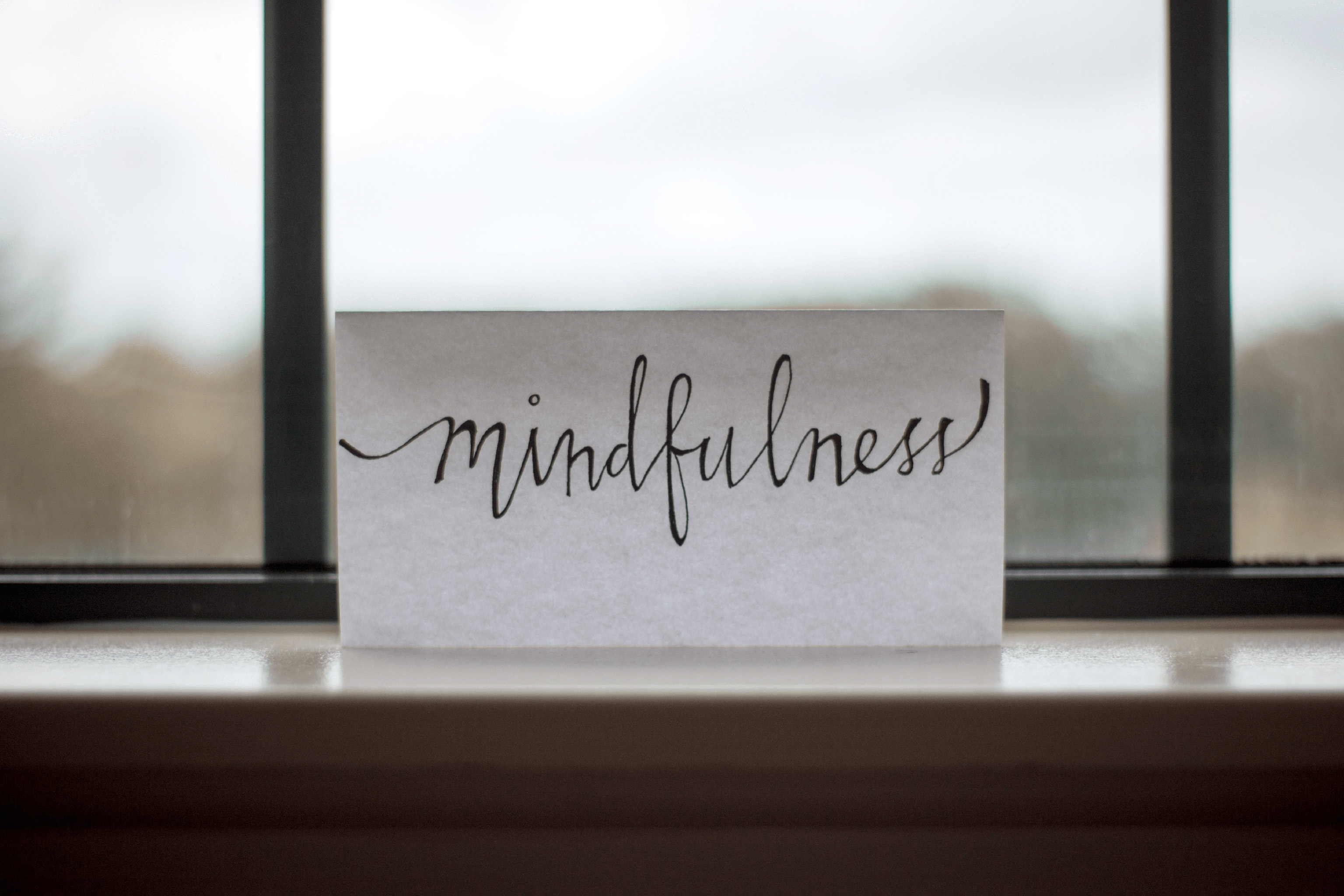 A piece of paper with the word Mindfulness written on it, mindfulness, mental health, mental health with chronic illness, self-care for chronic illness